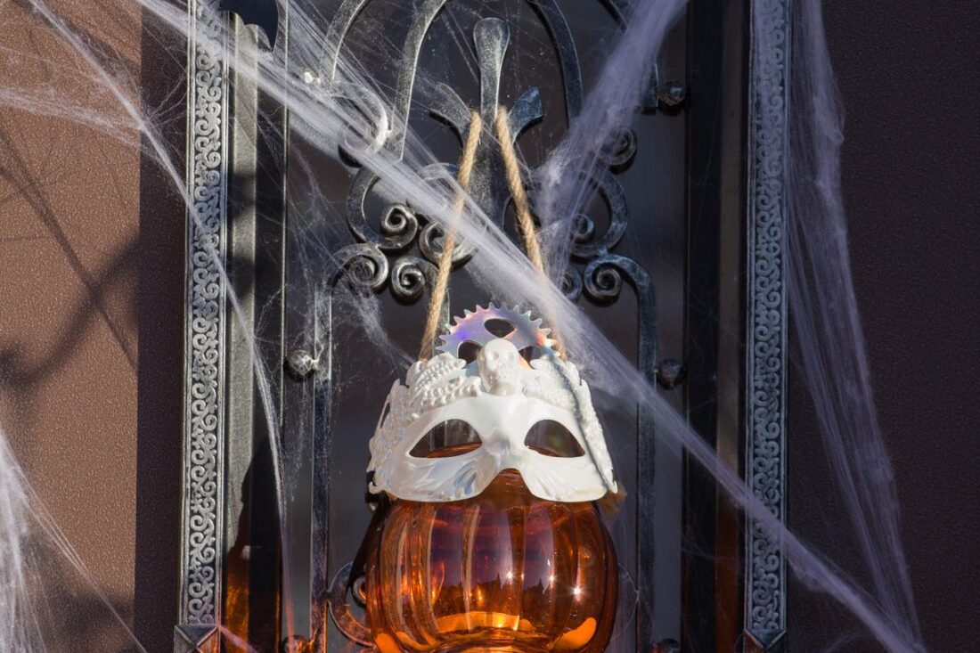 Halloween door handle draped in cobwebs