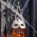 Halloween door handle draped in cobwebs