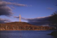 High Point Monument rising above Lake Marcia in autumn, High Point State Park, Sussex County NJ