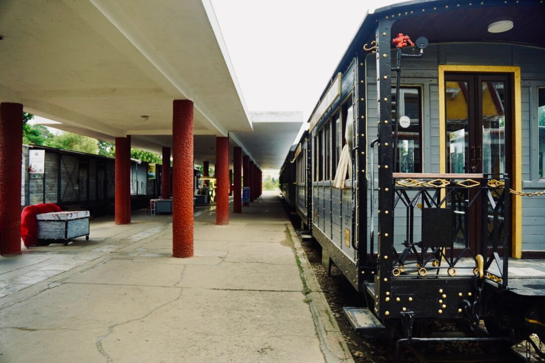 Vintage train parked at an empty railway station