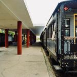Vintage train parked at an empty railway station