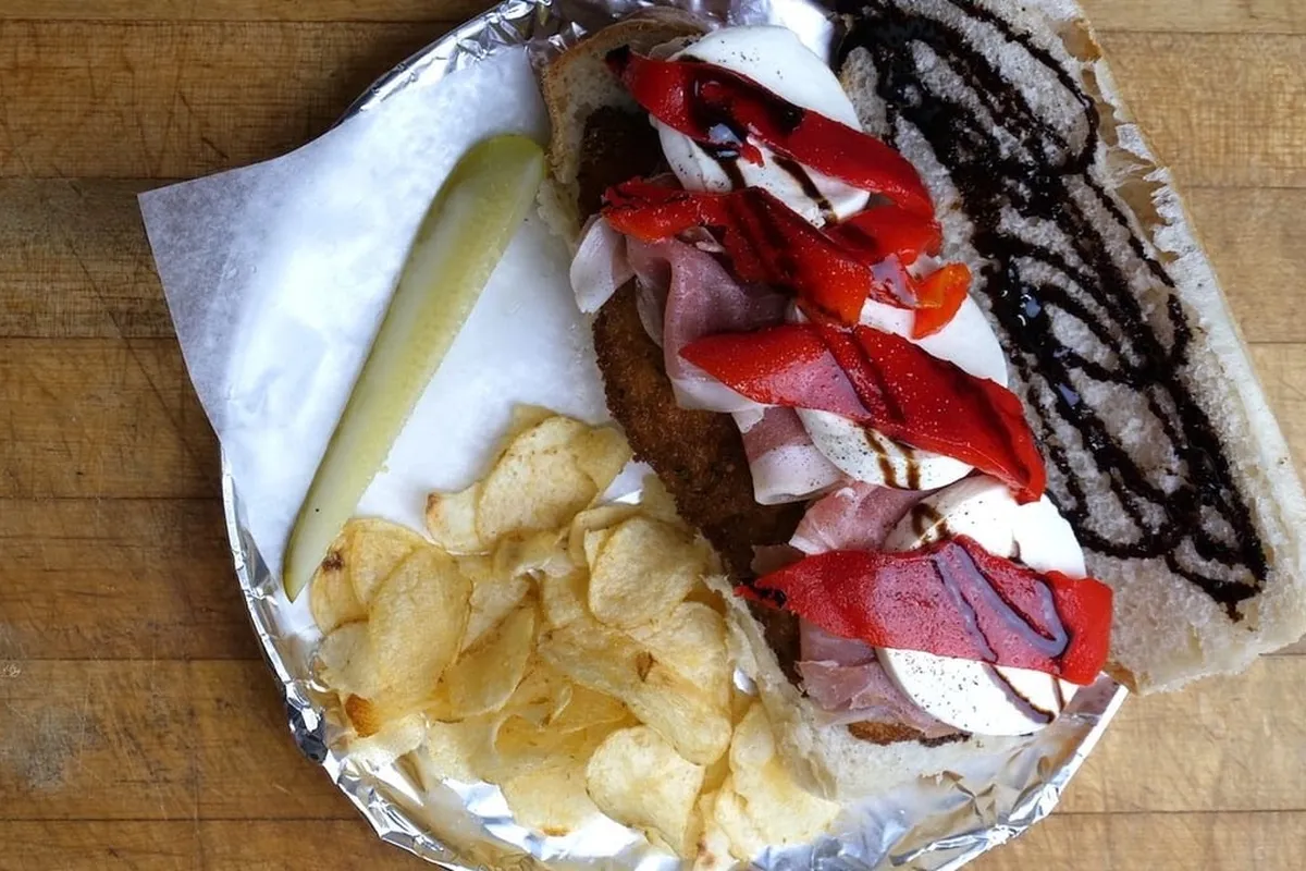 Sandwich with chips and a pickle from 3 In 1 Deli & Grocery in Hopatcong NJ