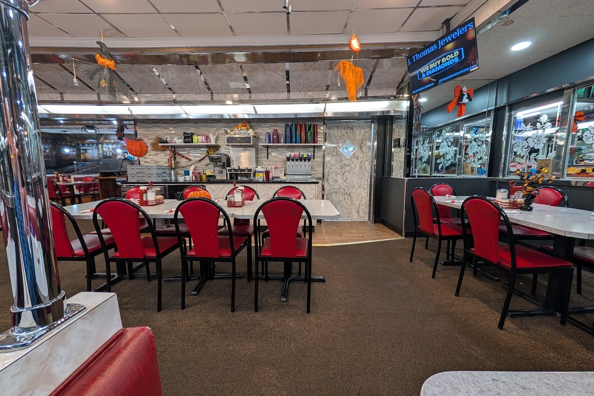Red booths and tables inside the dining room at Andover Diner on Main Street in Andover, NJ