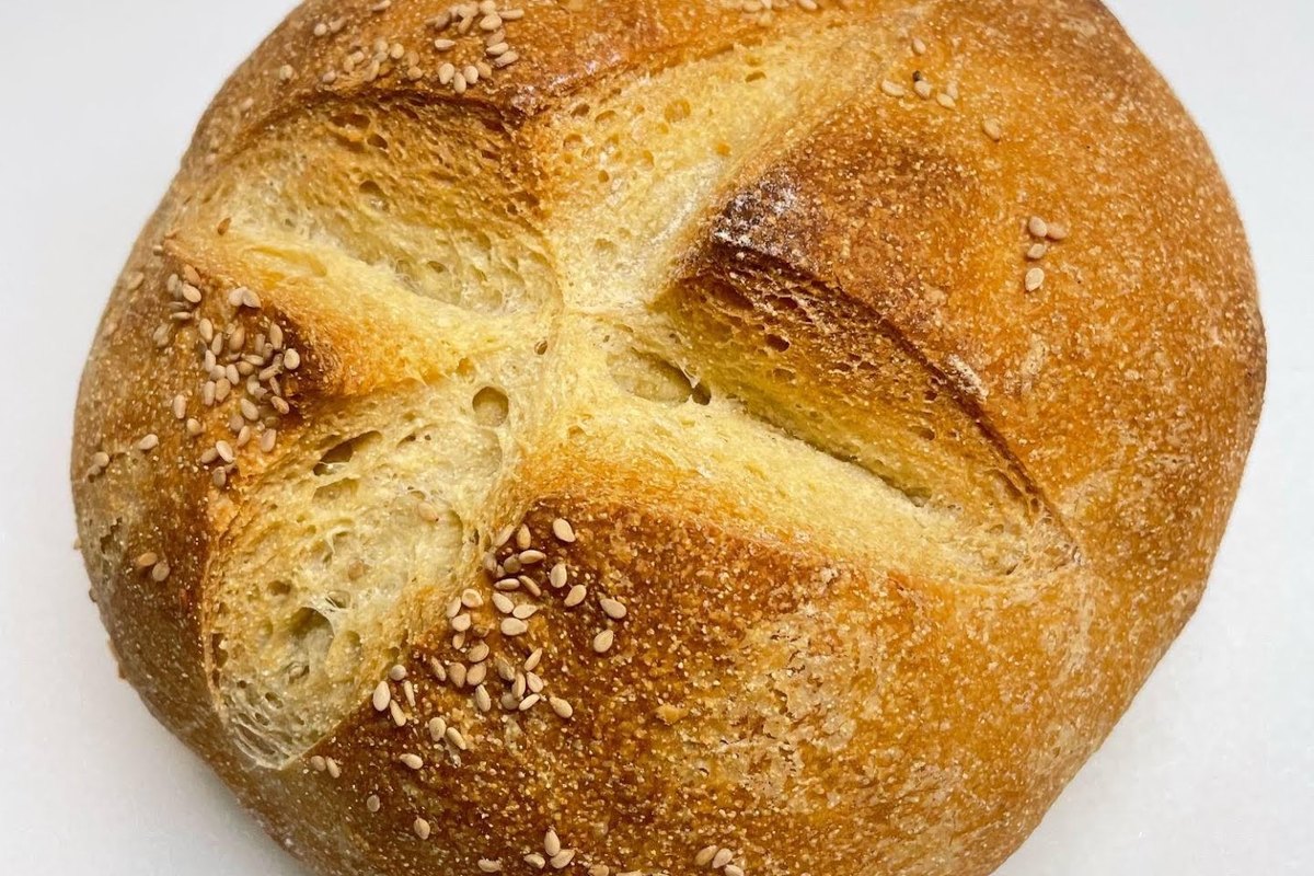 Round seeded loaf of bread from Cafe Pierrot's Andover Bakery on Main Street in Andover, NJ