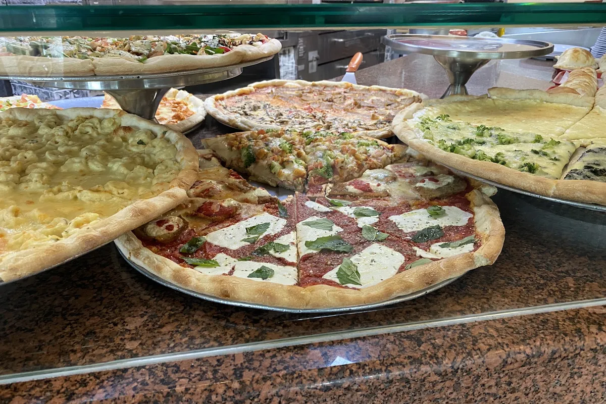 Specialty pizzas in the display case at Carlos' Cucina Italiana in Byram, NJ