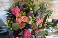 Bouquet of peach roses, pink peonies and purple flowers by Farmside Florist in Sussex NJ
