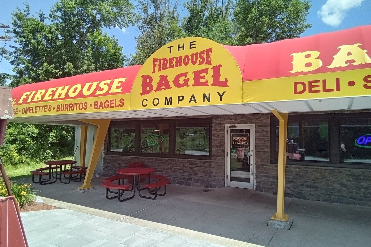 Firehouse Bagel Company storefront and outdoor tables on Route 206 in Branchville, NJ