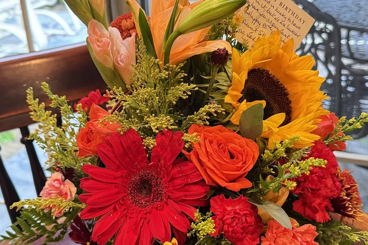 Sunflower and red gerbera arrangement from Four Seasons Florist in Stockholm NJ