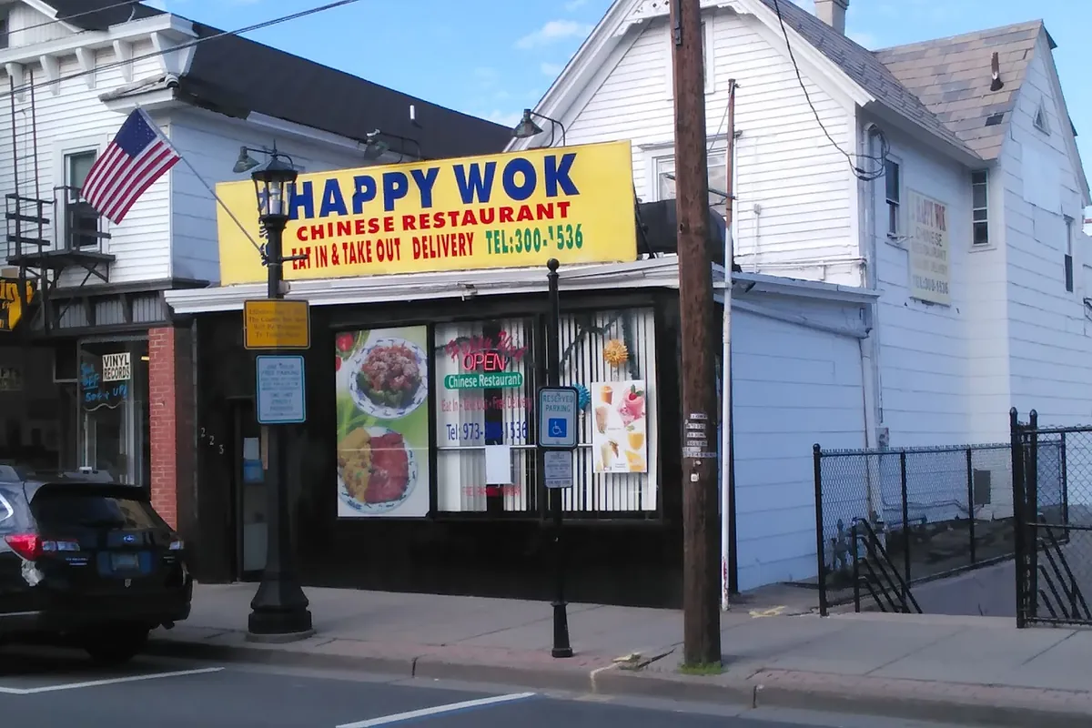 Happy Wok Chinese restaurant storefront on Spring Street in Newton, NJ