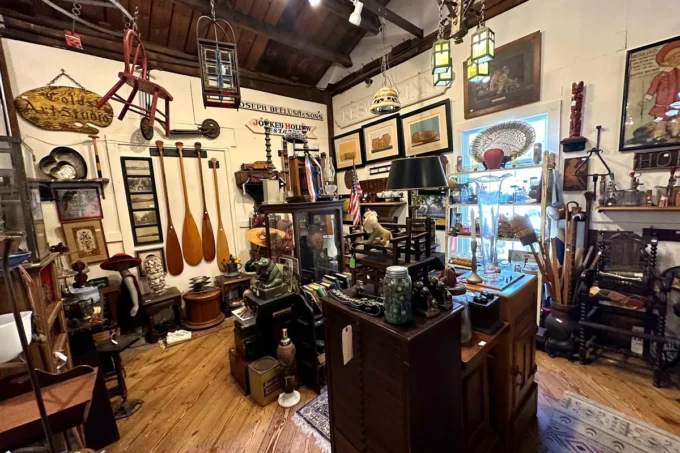 Antique furniture, lamps and collectibles inside the Lafayette Mill Antiques Center in Lafayette, NJ