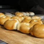 Fresh baked bagels on a wooden board at Leggo My Bagel in Stanhope, NJ