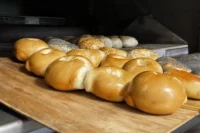 Fresh baked bagels on a wooden board at Leggo My Bagel in Stanhope, NJ
