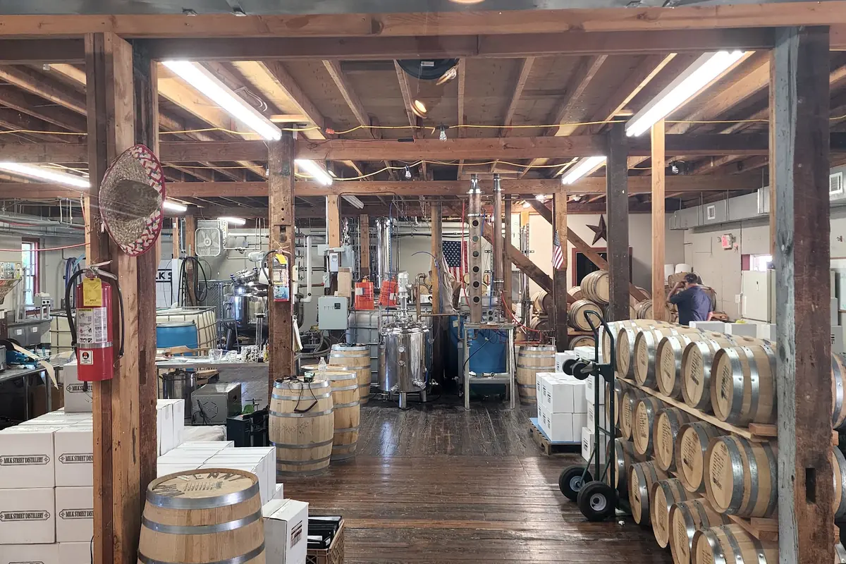 Stills and whiskey barrels inside Milk Street Distillery in Branchville, NJ