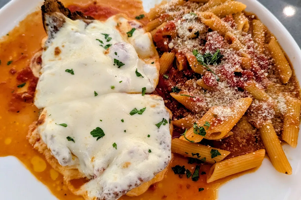Chicken with melted mozzarella and penne in red sauce at Mosaico Tavern in Byram, NJ
