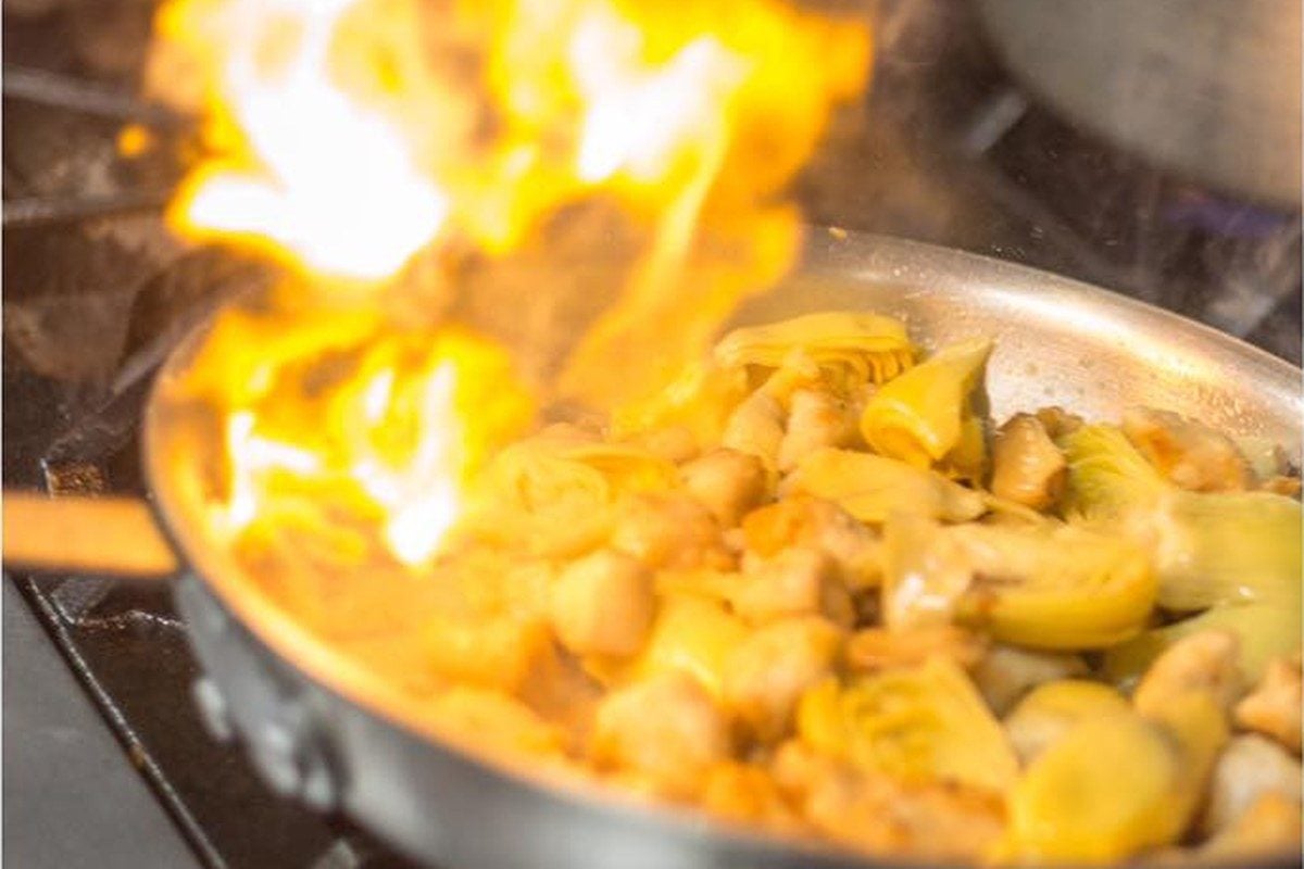 A pan flames on the stove at Nonna Vita Trattoria in Hamburg, NJ