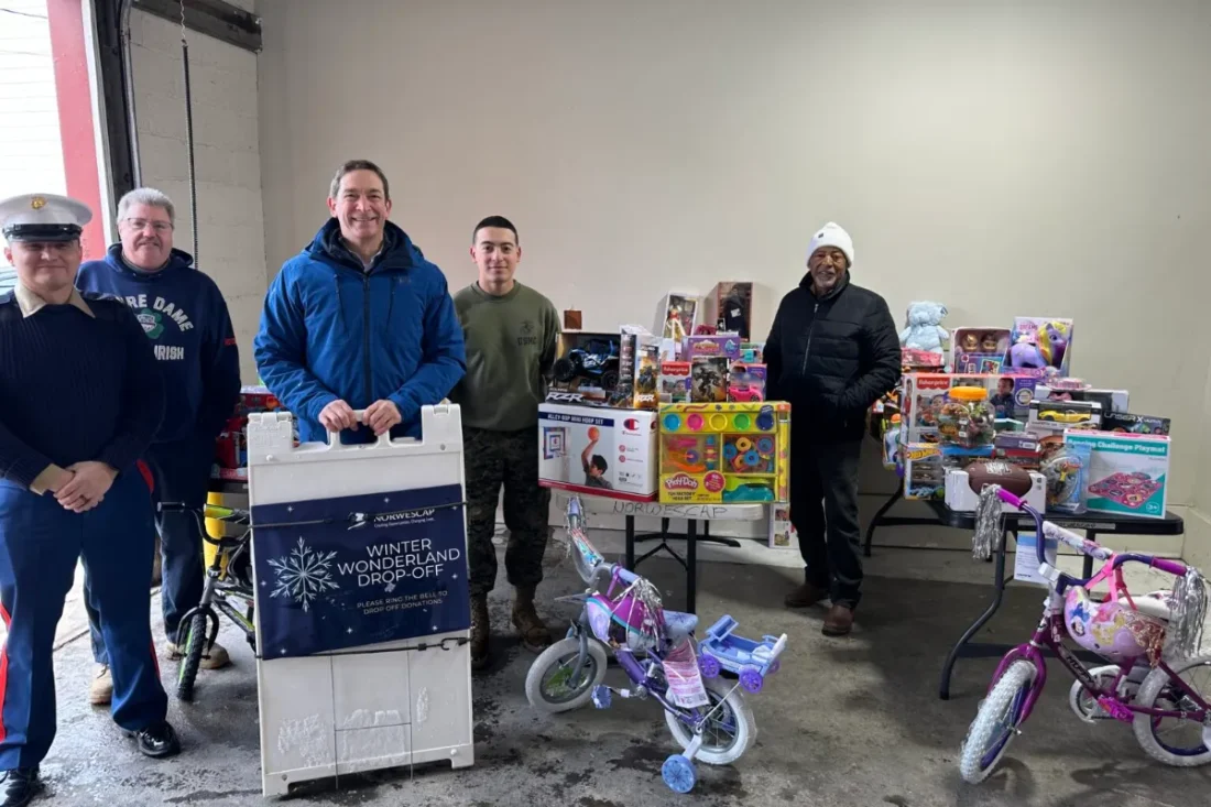 Norwescap volunteers and U.S. Marines with donated toys and bikes at the Winter Wonderland drop-off in Phillipsburg, NJ