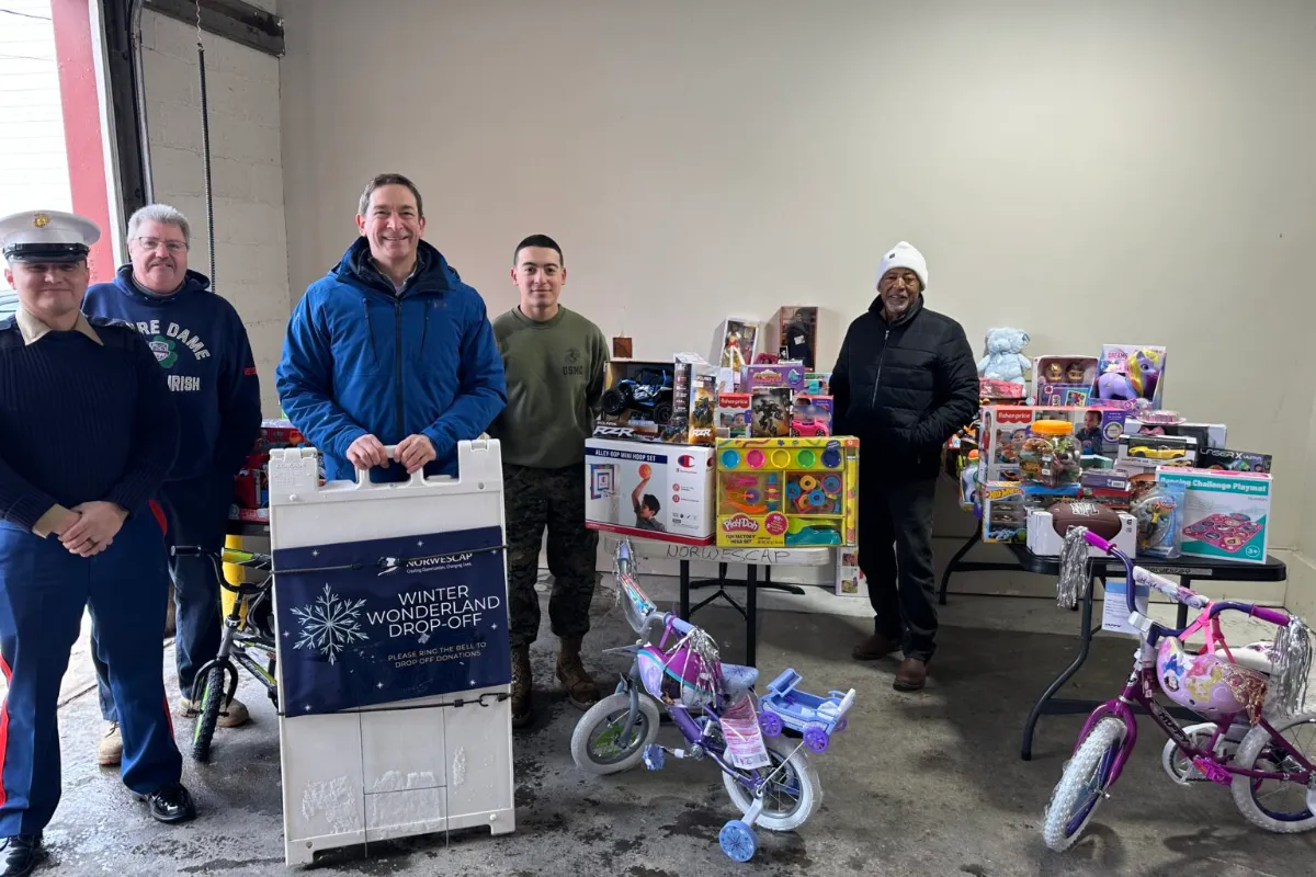 Norwescap volunteers and U.S. Marines with donated toys and bikes at the Winter Wonderland drop-off in Phillipsburg, NJ