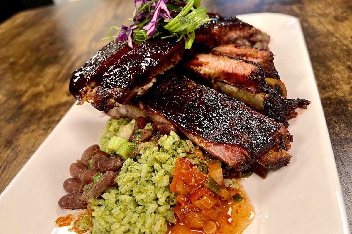 Glazed smoked ribs plated with sides at Olluco Bistro in Franklin, NJ