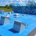 Blue outdoor Fitness Court with seven exercise stations on the Sussex County Community College campus in Newton, NJ