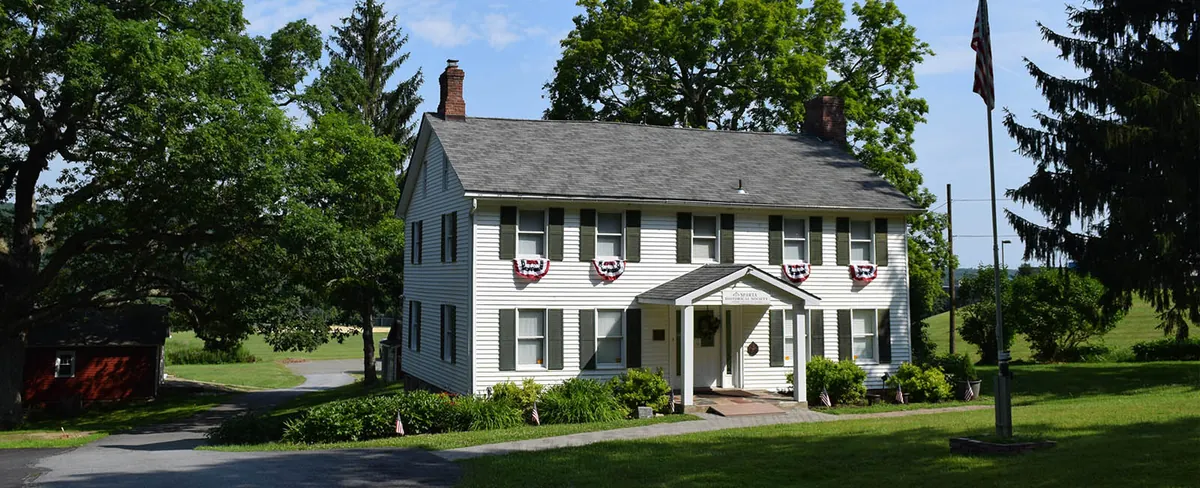 The white Van Kirk Homestead Museum farmhouse on Main Street in Sparta, NJ, run by the Sparta Historical Society